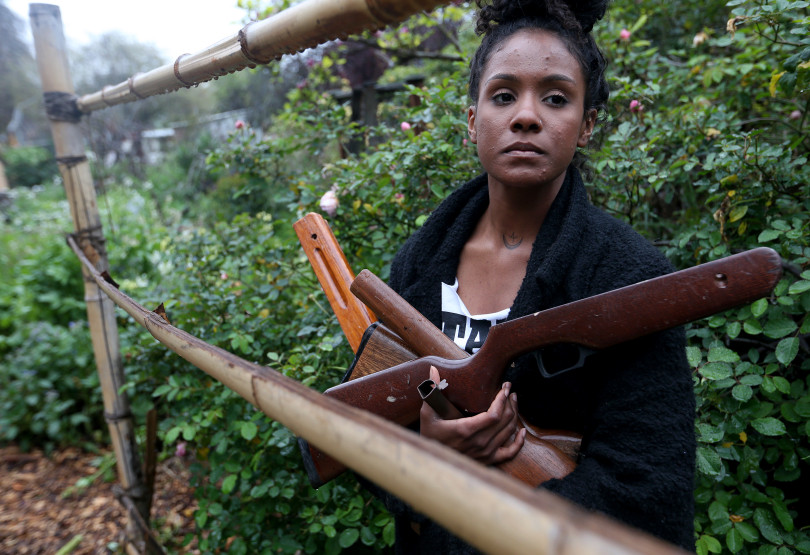 Bronte Velez, co-founder of Lead to Life, is photographed with guns obtained in a buyback program at her home in Oakland, Calif., on Tuesday, March 20, 2018. Velez and Kyle Lemie will be in Atlanta on April 6-8, the weekend of the 50th anniversary of the assassination of Martin Luther King, to to meet with King's daughter Bernice King and hold an "alchemy ceremony," where they will finish turning 50 weapons into 50 shovels. They will then use the shovels to plant trees. (Jane Tyska/Bay Area News Group)